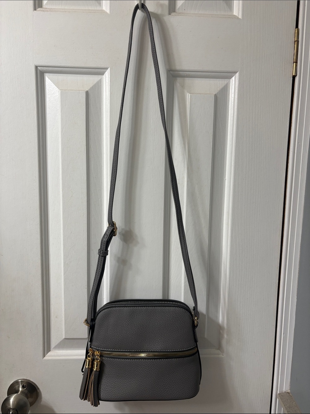 Compact Gray Pebbled Crossbody with Tassel Zipper